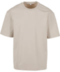 A plain beige T-shirt with short sleeves, crew neckline, and relaxed fit is shown on a white background. The shirt has no visible logos or designs.