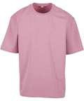 A plain light pink T-shirt short-sleeved crew neck tee is shown against a white background, featuring no logos or designs.