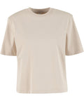 The T-Shirts product is a plain, short-sleeved beige tee with a crew neckline and relaxed fit, shown on a white background. It features no visible logos or designs for a simple look.