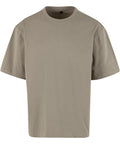 A solid beige T-shirt, featuring short sleeves and a crew neck, is displayed against a white background. The top is crafted from soft, lightweight fabric for comfort.