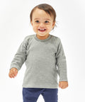 A smiling toddler wearing a gray Babybugz BZ011 long-sleeve shirt and dark pants stands against a plain white background.