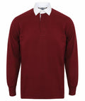 The FR100 rugby shirt by Front Row, featuring a maroon hue and white collar, is showcased against a simple white background. It boasts a classic design with a concealed button placket and ribbed cuffs.
