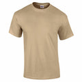 The Gildan GD002 is presented on a white background, featuring a plain beige design with short sleeves and a crew neckline, offering a simple, classic look.