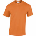 A Gildan t-shirt (product GD005) in orange is showcased on a plain background. It features short sleeves and a crew neckline, crafted from a soft-looking fabric. The tag inside the collar indicates it is from the Gildan Heavy Cotton line.