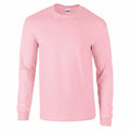 A Gildan GD014 long-sleeve T-shirt in a soft pink hue is displayed against a white background. The shirt features a simple design with a crew neck, highlighting its pastel color.