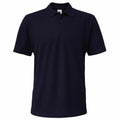 The GD017 by Gildan is a plain black polo shirt showcased against a white backdrop, featuring a classic collar, short sleeves, and a three-button placket.