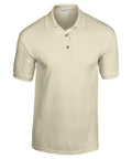 A simple, beige polo shirt featuring short sleeves and a three-button placket from the Gildan brand (Product Name: GD040) is displayed on a white background.