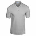 The Gildan GD040 is a plain, white short-sleeve polo shirt displayed against a white background. It features a collar and three buttons down the front.