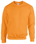 The GD056 by Gildan is an orange crewneck sweatshirt featuring long sleeves and displayed on a plain white background.