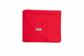A neatly folded Gildan GD101 bright red blanket with a visible corner showing a small white label on it, set against a white background.