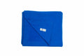 A neatly folded GD101 blanket in royal blue from Gildan, featuring a visible care label on one corner, set against a plain white background.