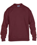 A plain burgundy sweatshirt, identified by product code GD56B from the brand Gildan, features long sleeves and a crew neckline. It is displayed against a white background and appears to be made from a soft, comfortable fabric.