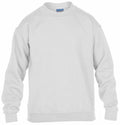 A Gildan GD56B crewneck sweatshirt in a plain, light gray color is shown on a white background. The sweatshirt is displayed facing forward, showcasing its long sleeves and ribbed cuffs. A small Gildan brand label can be seen at the neckline.