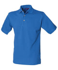 The HB100 by Henbury is a plain blue polo shirt featuring short sleeves and a collar, with a buttoned placket displaying two visible buttons. The product is shown against a white background.