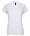 The Henbury HB102 is a plain white short-sleeved polo shirt featuring a collar and three buttons down the front, displayed against a white background.