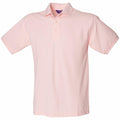 A Henbury HB400 polo shirt, featuring a light pink color, short sleeves, and a collar, is displayed against a white background. The shirt includes a three-button placket and is neatly folded.