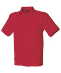Product Description: The Henbury HB400 is a red short-sleeve polo shirt featuring a classic collar and three-button design, presented on a plain white background.