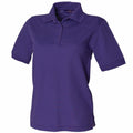 Product HB401 by Henbury is a plain purple polo shirt featuring short sleeves and a collar. The shirt, displayed against a white background, includes a button-up placket and side slits at the hem.