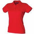 The Henbury HB476 is a vibrant red short-sleeved polo shirt featuring a collar and buttoned placket, showcased against a plain white background.