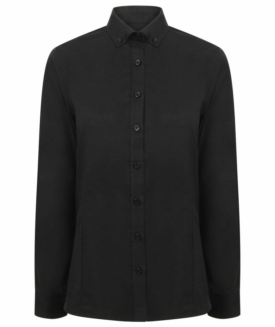 Henbury's HB513 is a plain black button-up shirt featuring long sleeves and a pointed collar, displayed on a white background.