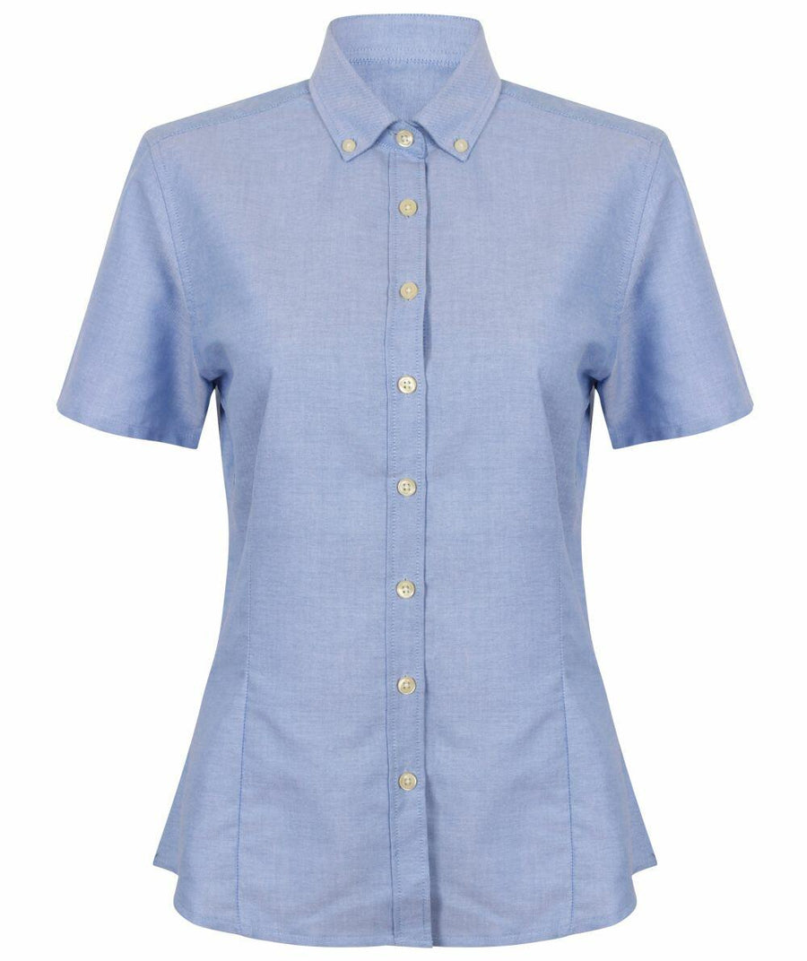 The HB518 by Henbury is a light blue short-sleeve button-up shirt featuring a pointed collar, displayed on a white background.