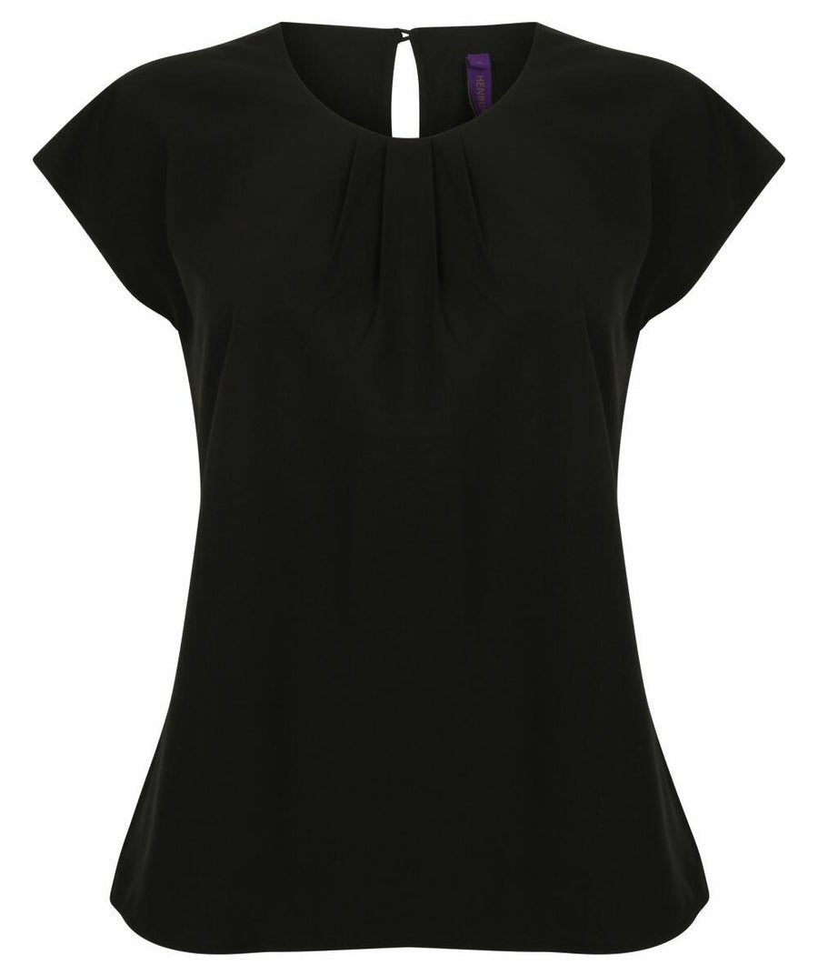 A Henbury HB597 blouse in black, featuring short sleeves, a round neckline, and pleated detailing.