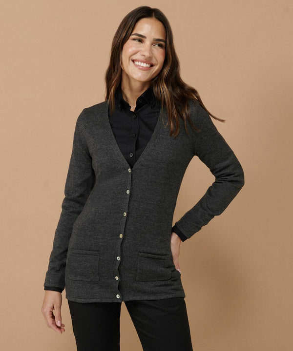 Person wearing a dark gray Henbury HB723 button-up cardigan over a black collared shirt, standing against a plain beige background with hands in pockets and smiling.
