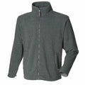 The Henbury HB850 is a dark gray fleece jacket featuring a zip-up design, high collar, and two side pockets.