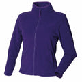 The Henbury HB851 purple fleece jacket features a high collar, full zipper, and long sleeves. It has a smooth texture with two side pockets, displayed against a plain white background.