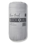 A rolled, light grey packaged blanket labelled "Blankets," approx. 135 x 200 cm, described as a plush combi quilt/throw. A barcode is visible on the packaging.