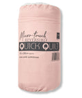 A packaged pink rolled-up micro-touch reversible "Blankets" quilt, labelled 135 x 200 cm, described as a plush combi quilt/throw.
