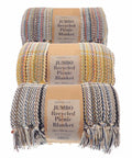 Three rolled, colorful recycled picnic blankets with "Home & Living HL207" labels stacked vertically. Each blanket features multicolored woven patterns and fringe ends.