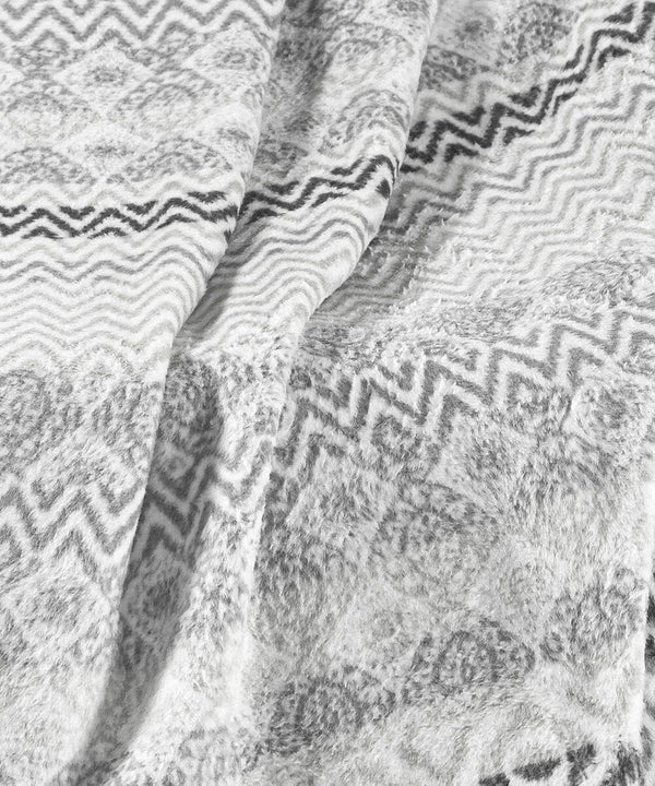 Close-up image of the Home & Living HL209 soft fabric featuring a zigzag and diamond pattern in shades of grey and white.