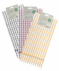 Three sets of tea towels with checkered patterns in gray, red, and yellow are displayed, each labeled "Home & Living" and "HL214" indicating they are made from sustainable materials.