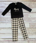 A set of children's pajamas, product code HL219 by Home & Living, featuring a black top with a dachshund design and plaid pants, displayed on a wooden surface.
