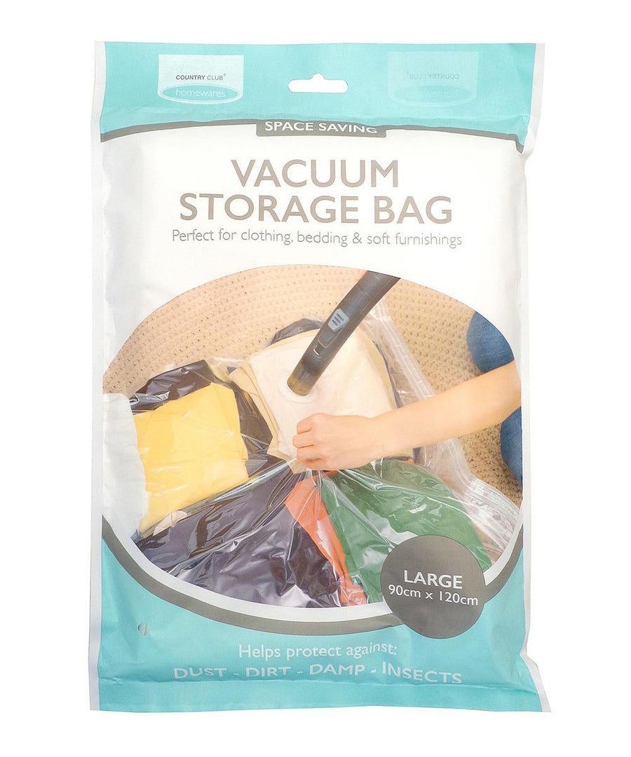 A sealed Home & Living Vacuum Bag (90cm x 120cm) for clothing, bedding, and soft furnishings. The packaging shows a hand using a vacuum hose to compress folded clothes inside.