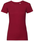 A J108F from Russell, featuring a plain design and short sleeves in crimson red, is shown against a plain white background. It has a round neckline with no visible logos or designs.