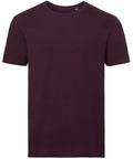 A plain dark purple t-shirt from Russell's J108M collection is displayed on a white background, showcasing a front view with a round neckline and short sleeves.