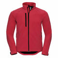 Introducing Russell's J140M: a lightweight red softshell jacket designed for outdoor activities. It features a zipper closure, long sleeves, a high collar, and multiple zippered pockets on the front and sides for convenience.