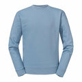 A Russell J262M sweatshirt in a light blue shade is shown against a white background. This crew-neck, long-sleeve garment looks soft and comfortable, perfect for casual wear.