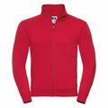 Introducing the J267M by Russell: a vibrant red zip-up jacket with a high collar. Designed with two front pockets and a visible zipper, this stylish piece also includes a neck tag. The jacket is showcased against a plain white background.