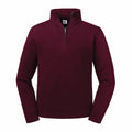 The Russell J270M is a maroon quarter-zip pullover sweater featuring a standing collar and ribbed cuffs.