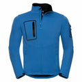 Introducing the J520M from Russell: A stylish zip-up jacket in blue with a high collar, black zipper accents, and multiple pockets for added convenience.