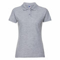 The Russell J539F is a light gray short-sleeved polo shirt featuring a collar and button-up placket. It boasts a simple design and seems to be crafted from a soft, woven material.