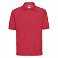 Russell's J539M is a red polo shirt featuring a collar and short sleeves, showcased against a plain white background.