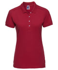 A red short-sleeved polo shirt from Russell's J566F line, featuring a collar and three buttons, is showcased against a plain white background.