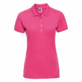 The Russell J566F is a vibrant bright pink short-sleeve polo shirt featuring a collar and a button-up neckline. It's displayed on a plain white background, accentuating the shirt's vivid color and straightforward design.