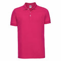 The J566M by Russell is a short-sleeved polo shirt in bright pink, featuring a classic collar and a three-button placket. This plain shirt has no visible logos or patterns and is showcased against a white background.