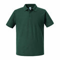 A plain green short-sleeve polo shirt from Russell, featuring a collar and three buttons, known as the J570M.