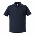 The product image showcases the J570M, a plain black polo shirt with a collar and short sleeves by Russell, set against a white background.